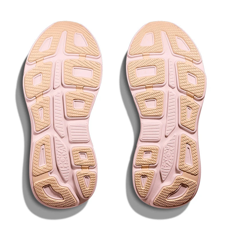 Pink and beige shoe sole with tread pattern on a white background