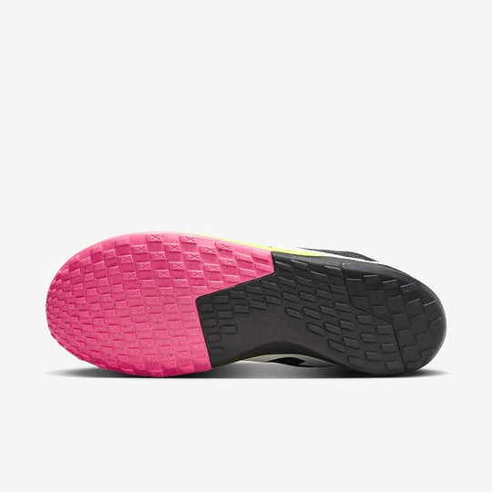 Close-up of a shoe sole with pink and black tread pattern on a white background