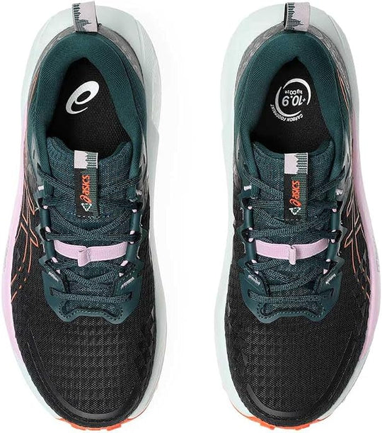 A pair of Asics Gel Trabuco 13 running shoes shown from a top-down view, featuring a black mesh upper with dark teal overlays, light purple laces, and a white midsole with a pink and orange outsole.