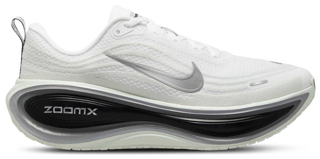 A white Nike Vomero Plus RR - Men's running shoe with a textured mesh upper, a metallic silver Swoosh, and a thick black and white ZoomX cushioned midsole, shown from a side profile on a white background.