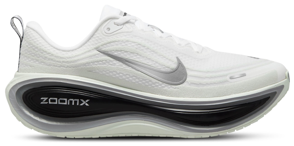 A white Nike Vomero Plus RR - Men's running shoe with a textured mesh upper, a metallic silver Swoosh, and a thick black and white ZoomX cushioned midsole, shown from a side profile on a white background.