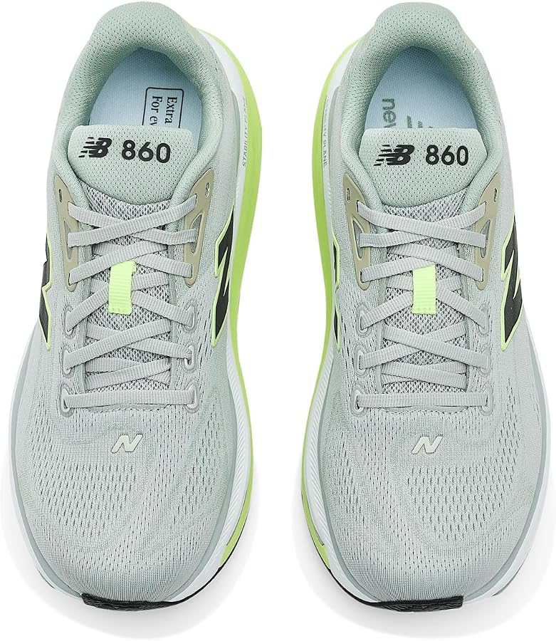 A pair of New Balance Fresh Foam X 860 V15 running shoes in light gray with neon green accents, shown from a top-down view on a white background.