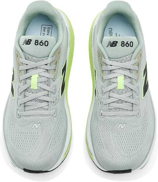 A pair of New Balance Fresh Foam X 860 V15 running shoes in light gray with neon green accents, shown from a top-down view on a white background.