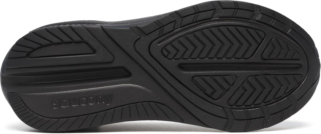 Close-up of the black rubber outsole of a shoe, showing tread patterns and the embossed brand name &