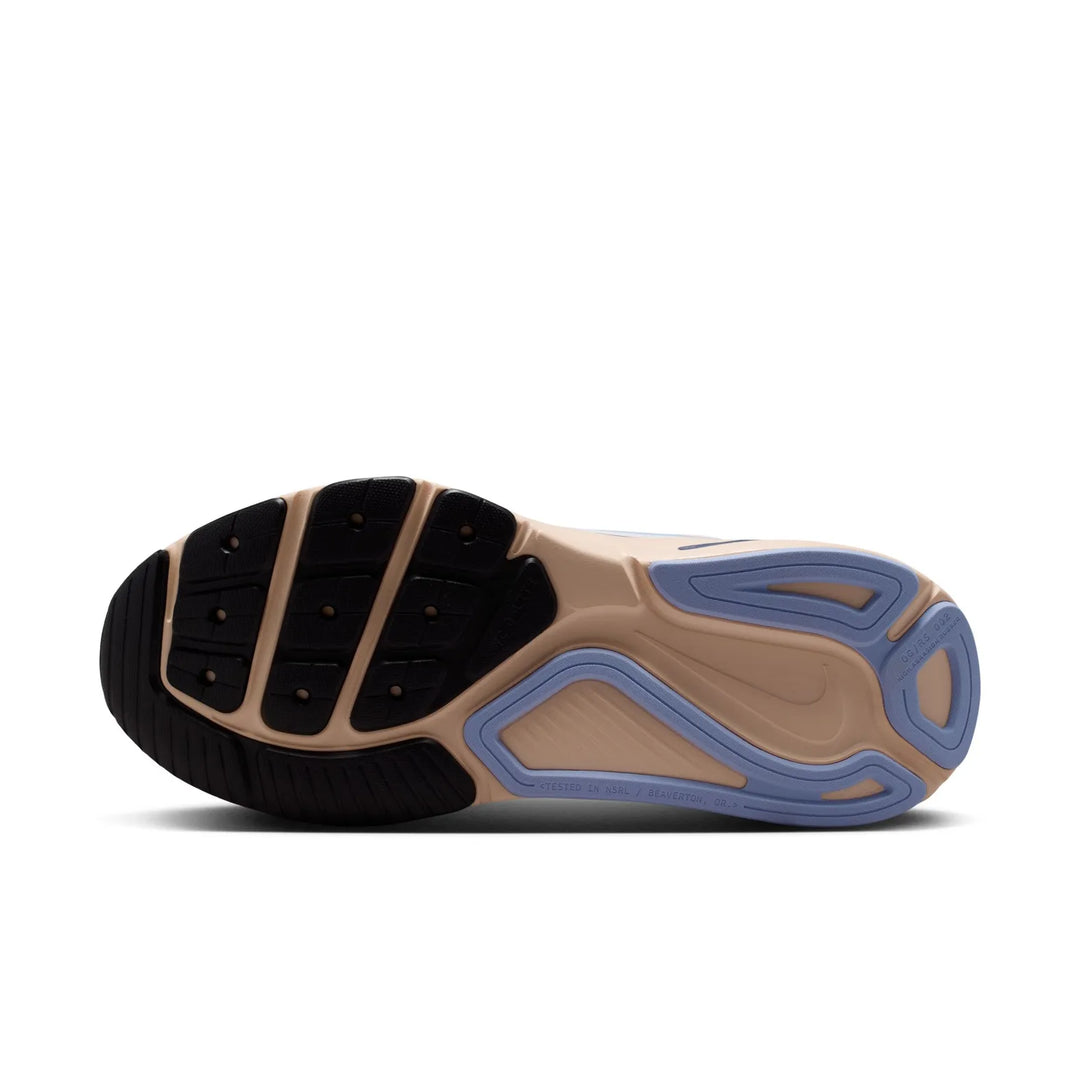 Close-up of a shoe sole with black, brown, and blue color pattern on a white background