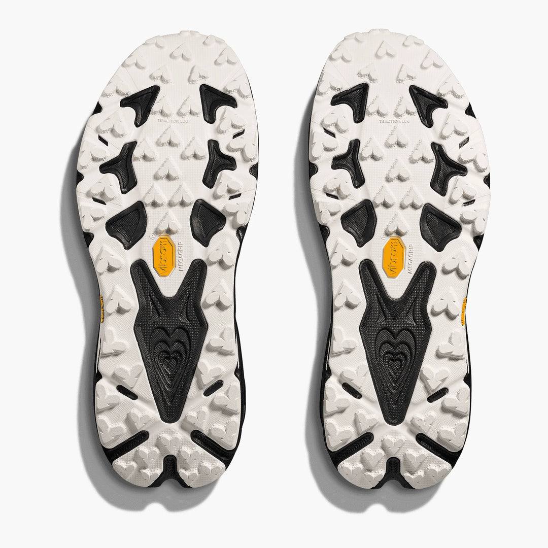Close-up of the sole of a shoe with tread pattern and brand logo on a white background
