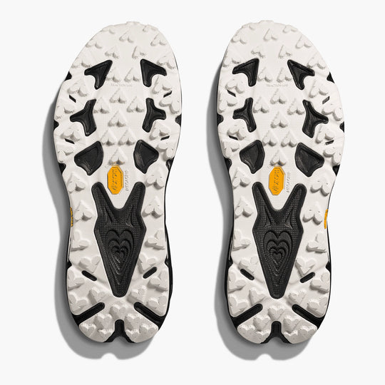 Close-up of the sole of a shoe with tread pattern and brand logo on a white background