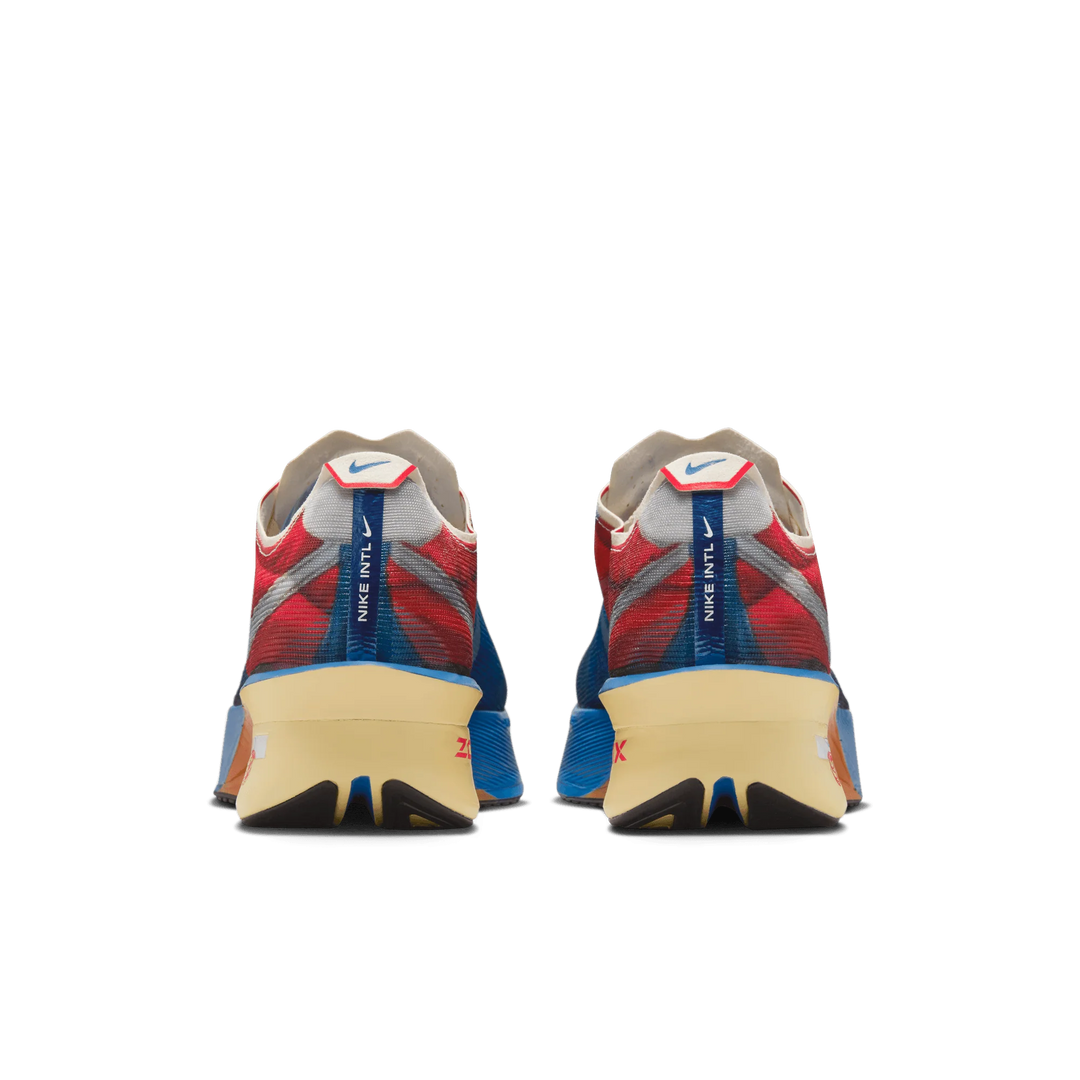 A pair of Nike Vaporfly 4 Premium running shoes shown from the rear, featuring a red and blue mesh upper, a beige midsole, and a blue pull tab with the Nike WFTL logo.