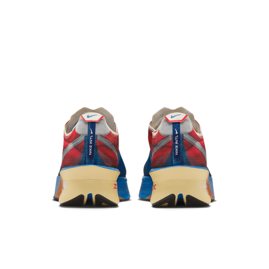 A pair of Nike Vaporfly 4 Premium running shoes shown from the rear, featuring a red and blue mesh upper, a beige midsole, and a blue pull tab with the Nike WFTL logo.