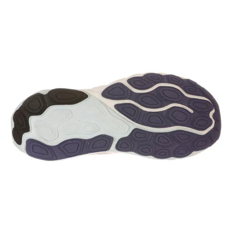 A close-up of a shoe sole showing its tread pattern and color combination of dark navy, white, and black on a plain white background.