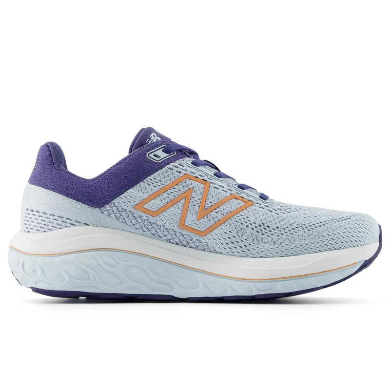 A New Balance 860 V14 running shoe in light blue and purple with a prominent orange 'N' logo on the side, shown against a plain white background.