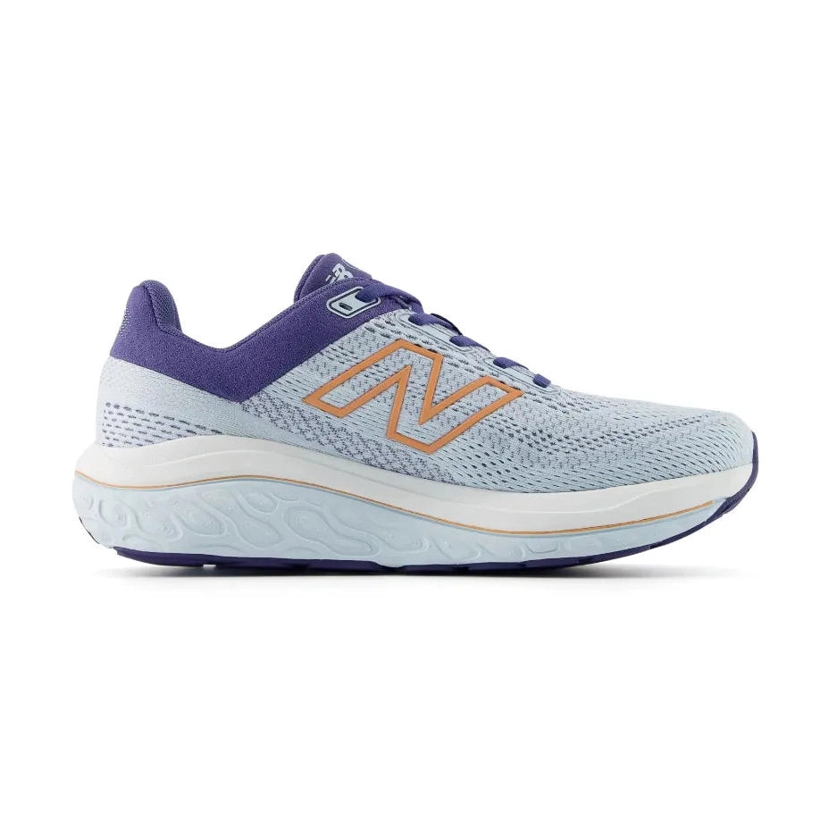 A New Balance 860 V14 running shoe in light blue and purple with a prominent orange 'N' logo on the side, shown against a plain white background.