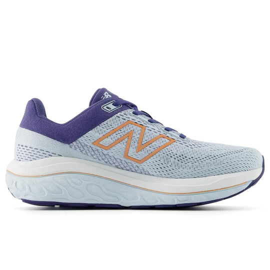 A New Balance 860 V14 running shoe in light blue and purple with a prominent orange &
