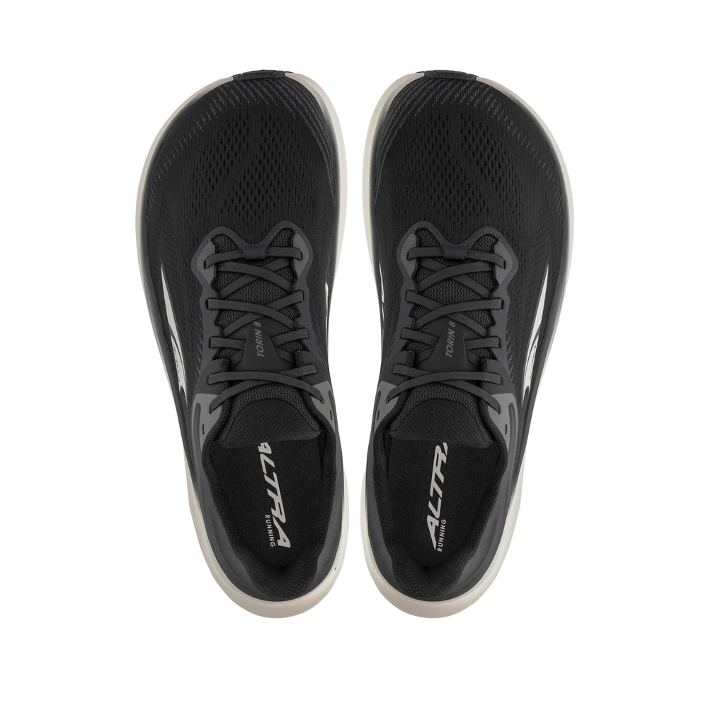Torin 8 a men's black running shoes with white soles on a white background.