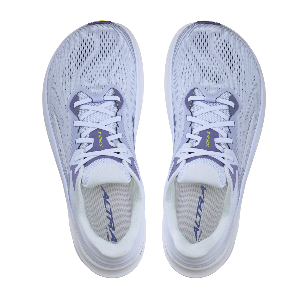 Torin 8 a women's white running shoes with purple accents on a white background.
