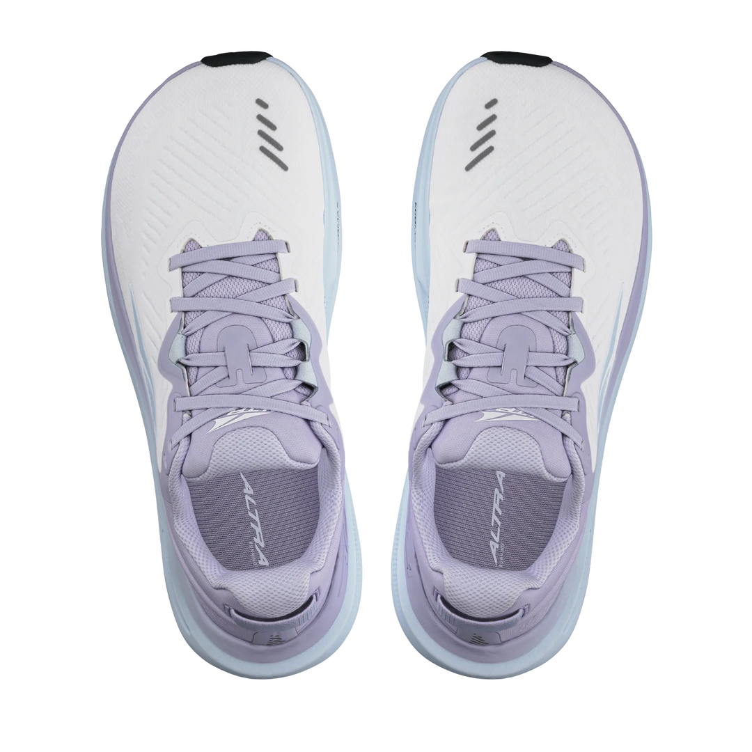 Pair of light purple athletic shoes with white soles on a white background