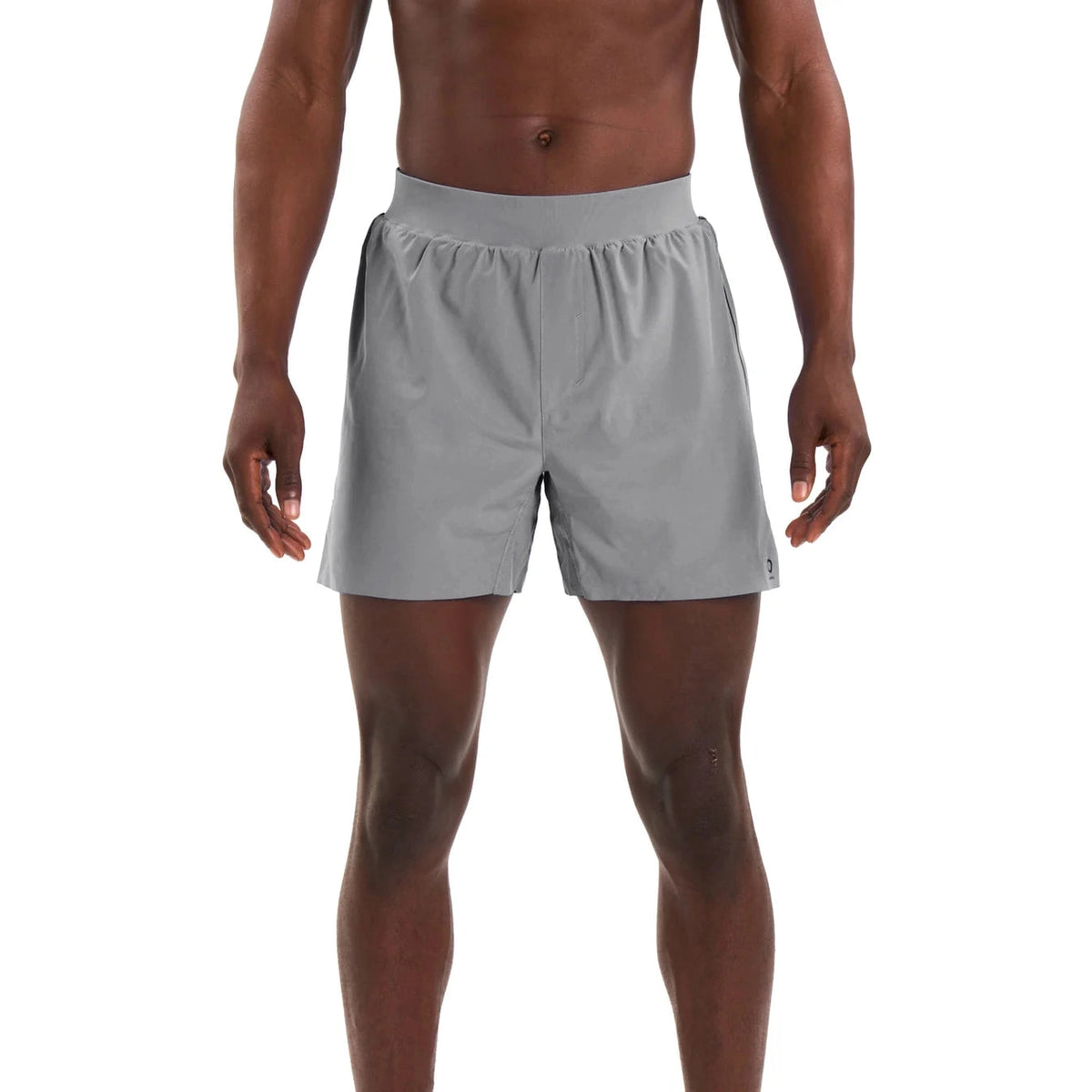 A man wearing Alwrld Alrn N.B.P. Short – Men's light gray athletic shorts, shown from the chest down against a plain white background.