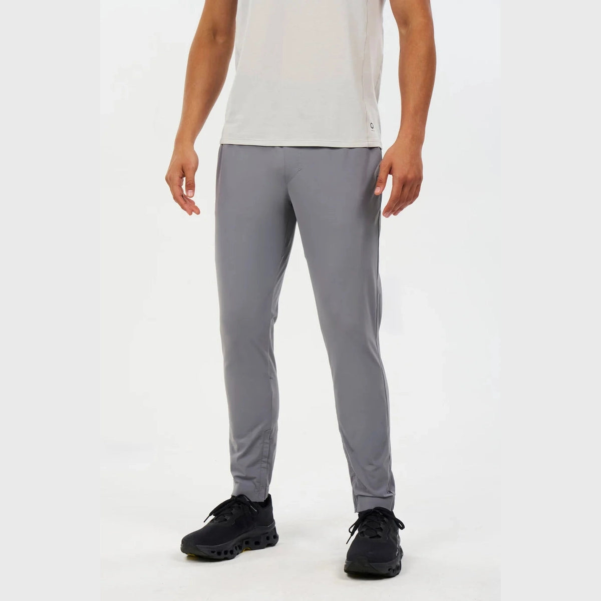 Person wearing Alwrld Alrn Gran Sport Jogger – Men's and black shoes on a white background