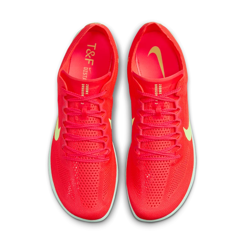 A pair of Nike Dragonfly 2 – Men's running shoes in a vibrant red and pink colorway, featuring a bright pink interior, neon yellow-green Swooshes, and light gray soles, shown from a top-down view on a white background.