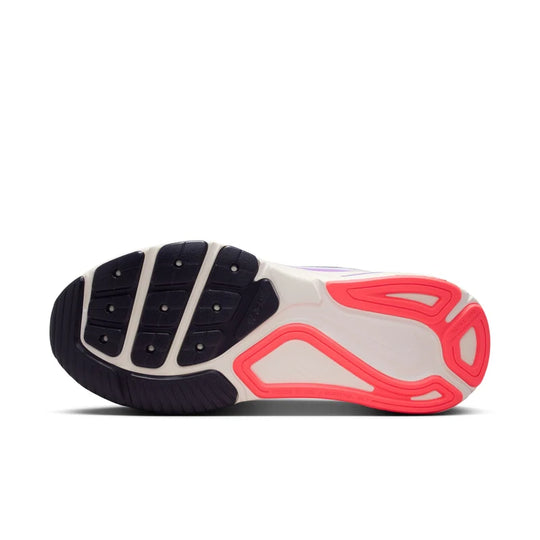 Close-up of a shoe sole with black, gray, and red design on a white background