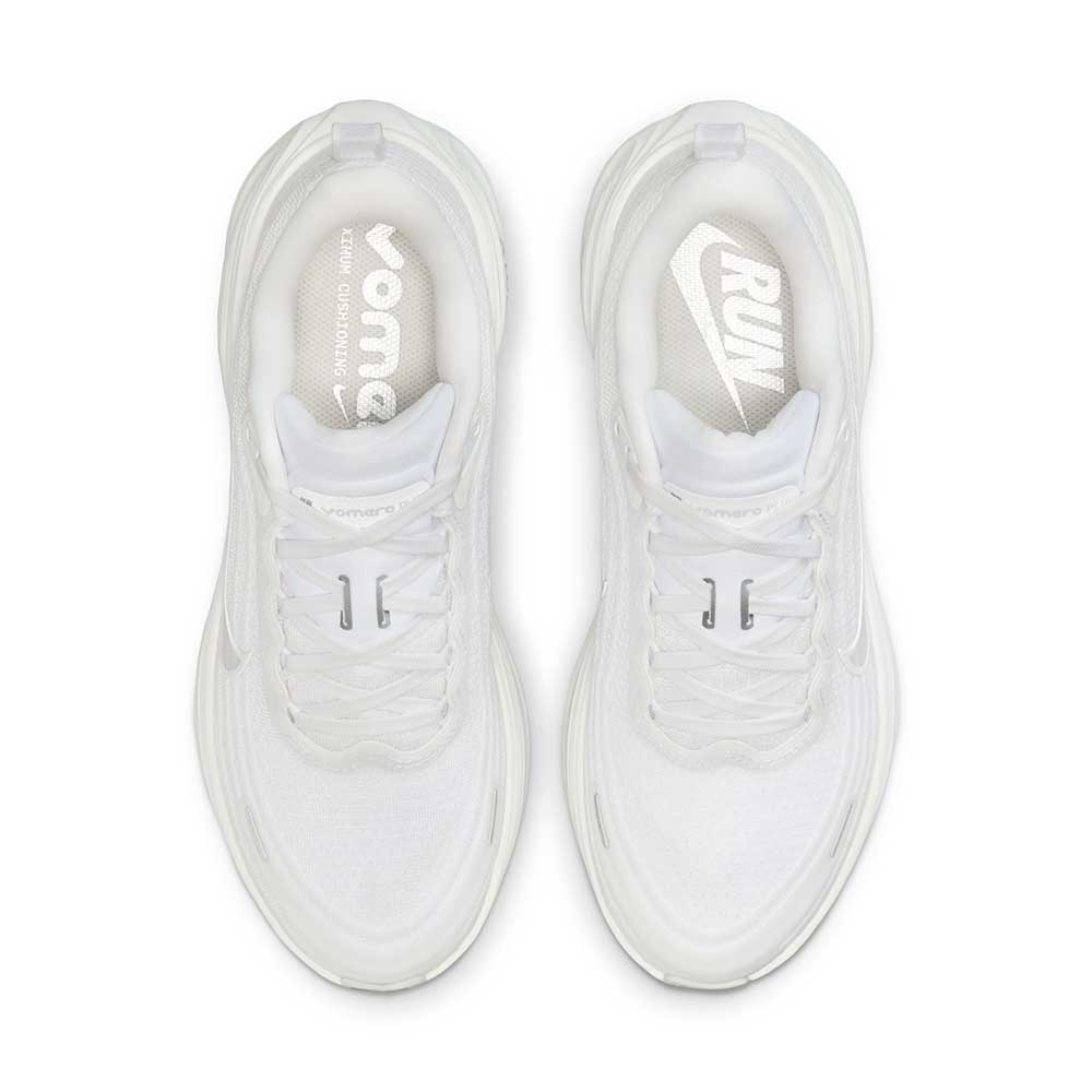 White Nike Vomero Plus - Women's sneakers with visible branding on a white background