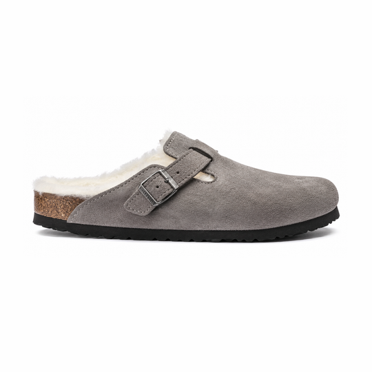 A single gray suede Birkenstock Boston Shearling--Suede Stone Coin clog-style slipper with a white shearling lining, a brown cork midsole, and a black outsole, shown from a side profile on a white background.