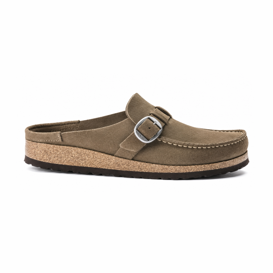 A single taupe-brown suede BIRKENSTOCK Buckley clog shoe with a silver buckle strap, cork midsole, and black outsole, shown from a side profile on a white background.