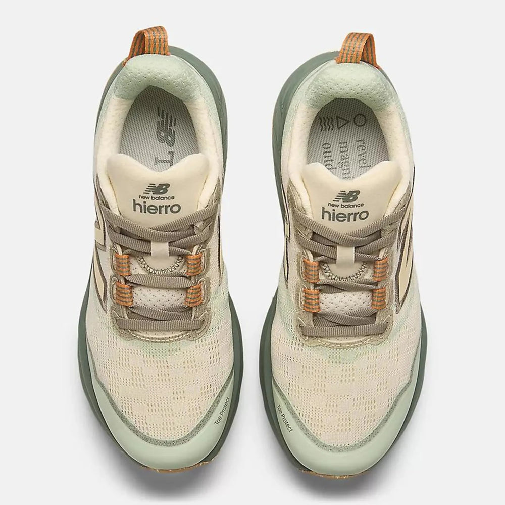 A pair of New Balance Fresh Foam X Hierro V9 – Women's trail running shoes shown from a top-down view against a light gray background. The shoes feature a cream mesh upper with sage green accents on the collar, midsole, and outsole, brown laces, and a tan pull tab.