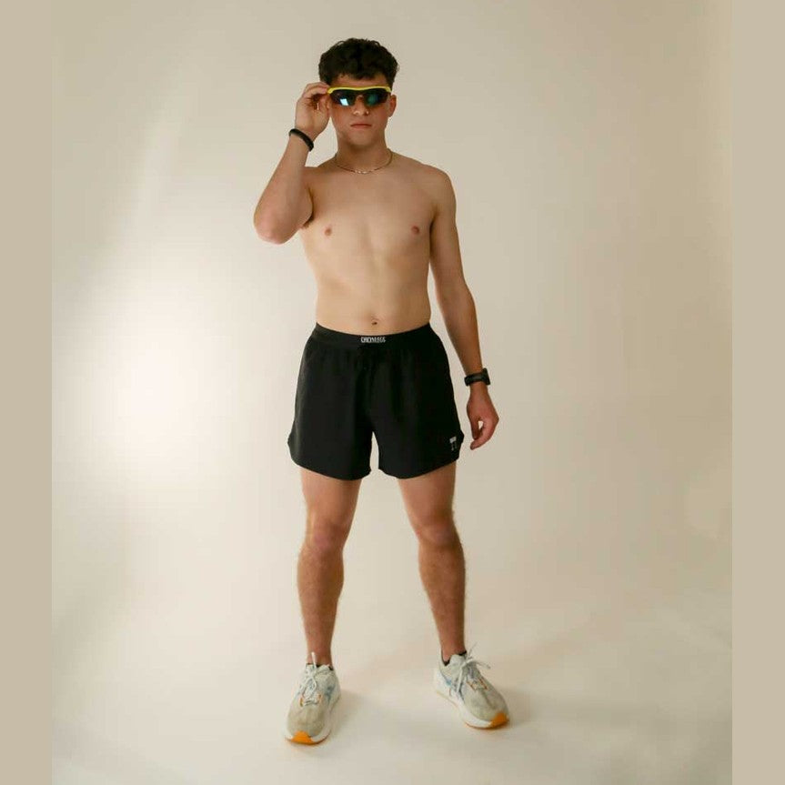 Man wearing black Chicknlegs 5" Running Shorts – Men&
