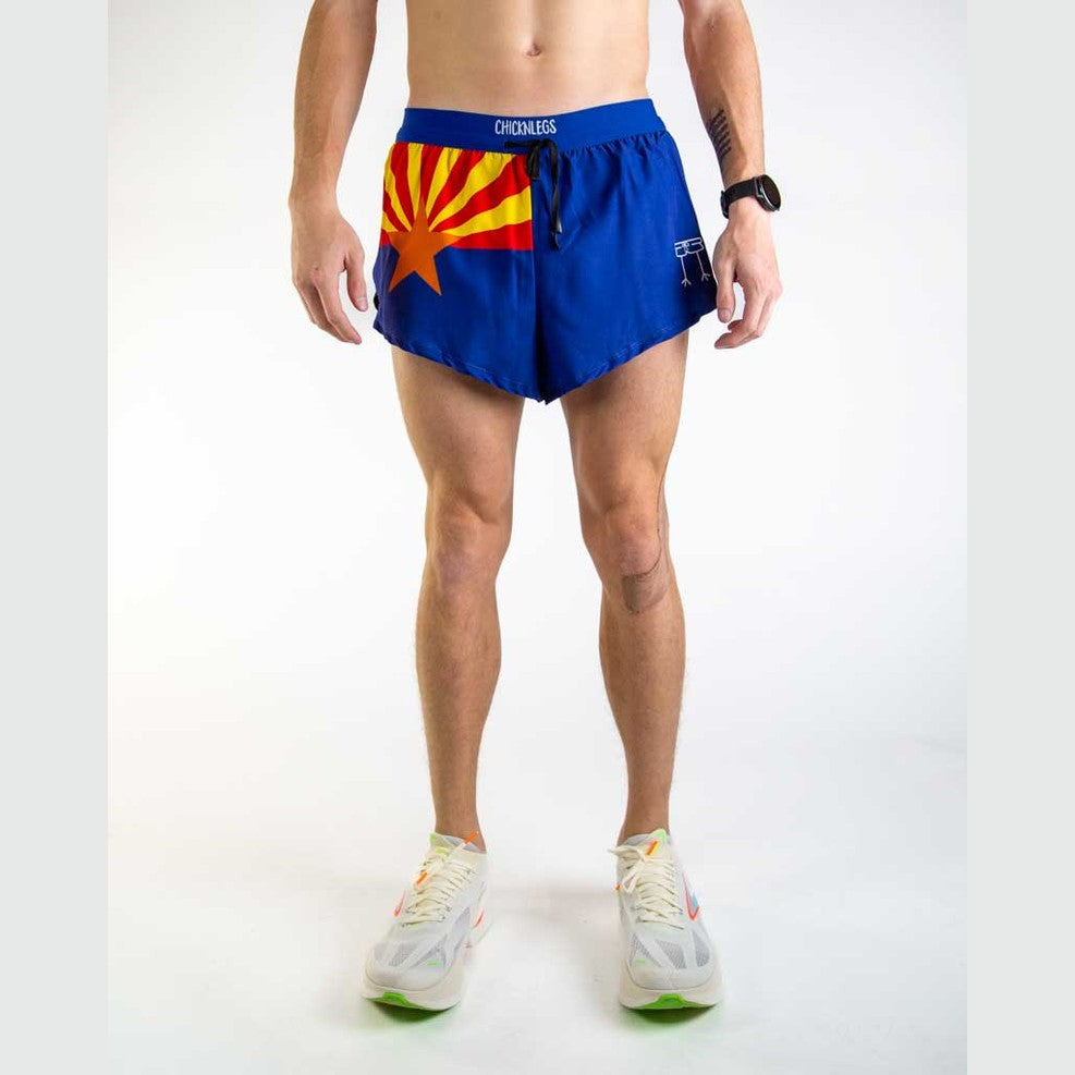 Person wearing blue Chicknlegs 2" Split Shorts – Men's with a colorful design on a white background
