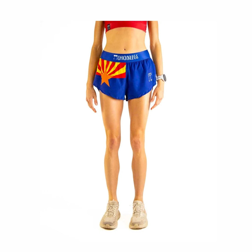 Person wearing blue Chicknlegs 1.5" Split Shorts – Women's with a colorful design on a white background