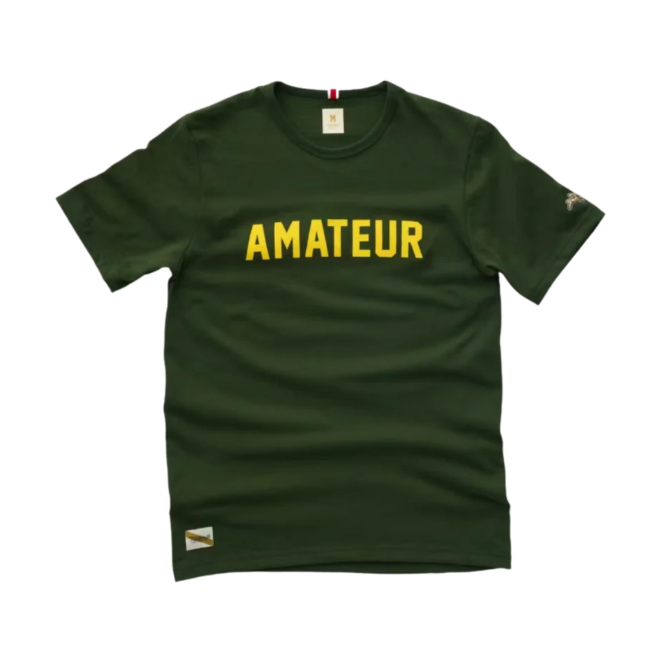 A dark green Grayboy Tee – Men's with the word 'AMATEUR' printed across the chest in bold yellow letters, shown against a plain white background.