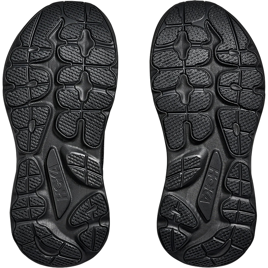 Black rubber sole of a shoe with brand logo on a white background
