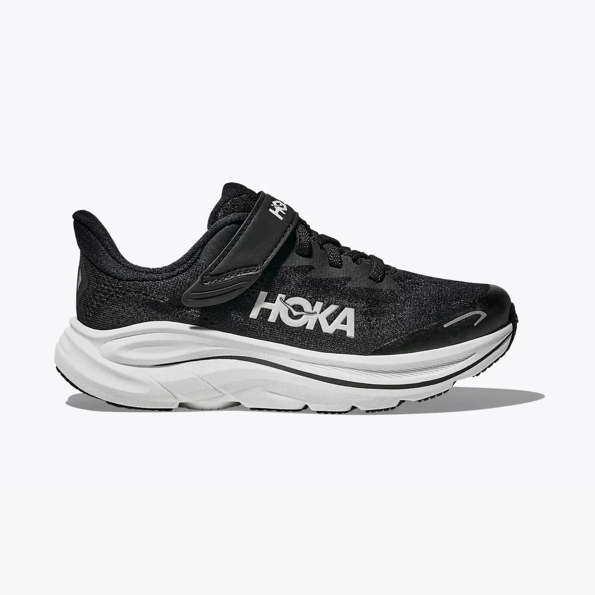 Black Clifton 10 -- Youth  running shoe with a white sole on a white background