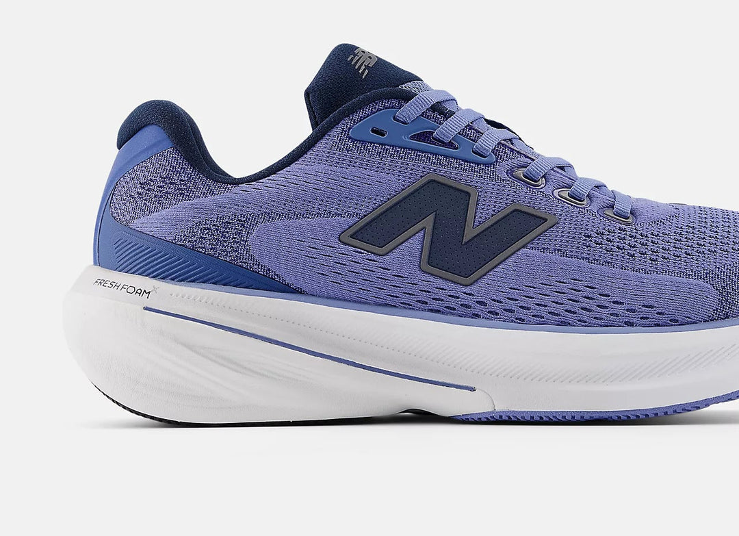 Blue running shoe with New Balance logo on a light gray background