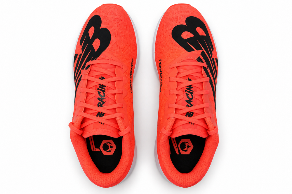 A pair of New Balance Xc7 V4 – Men's running shoes in a vibrant neon orange-red colorway with black accents and the signature 'NB' logo, shown from a top-down view on a white background.