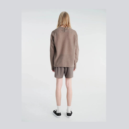 A model shown from the back wearing a textured taupe-brown long-sleeve Fuzz Fleece AD Long Tee--Men&