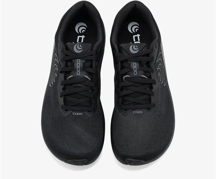Pair of Topo Athletic Magnifly 6 – Men's black athletic shoes with a brand logo on a white background