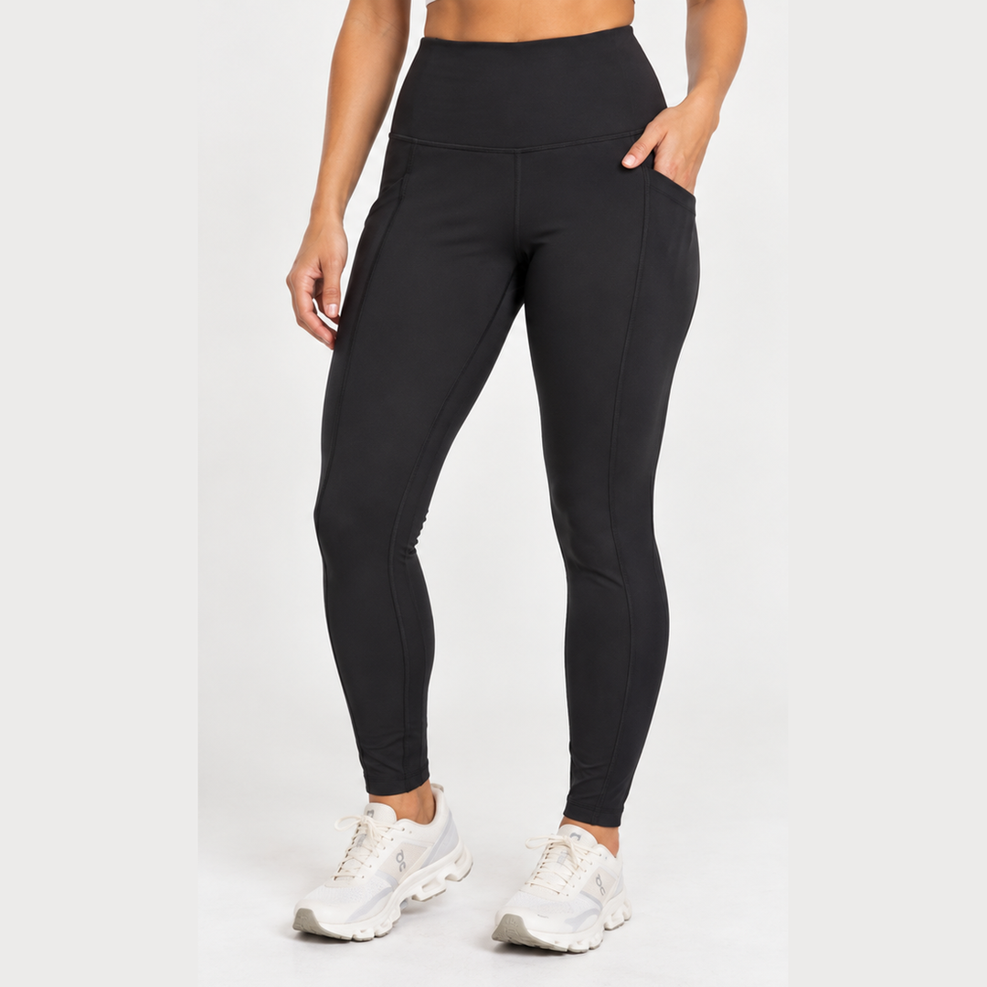 A model wearing black high-waisted Run Tights – Women&