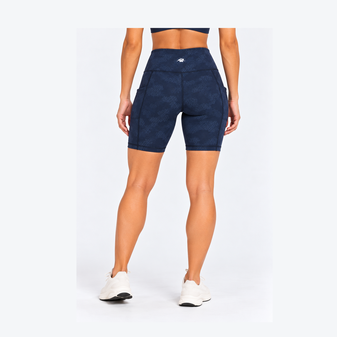 Rear view of a model wearing 7" Running Bike Short – Women&