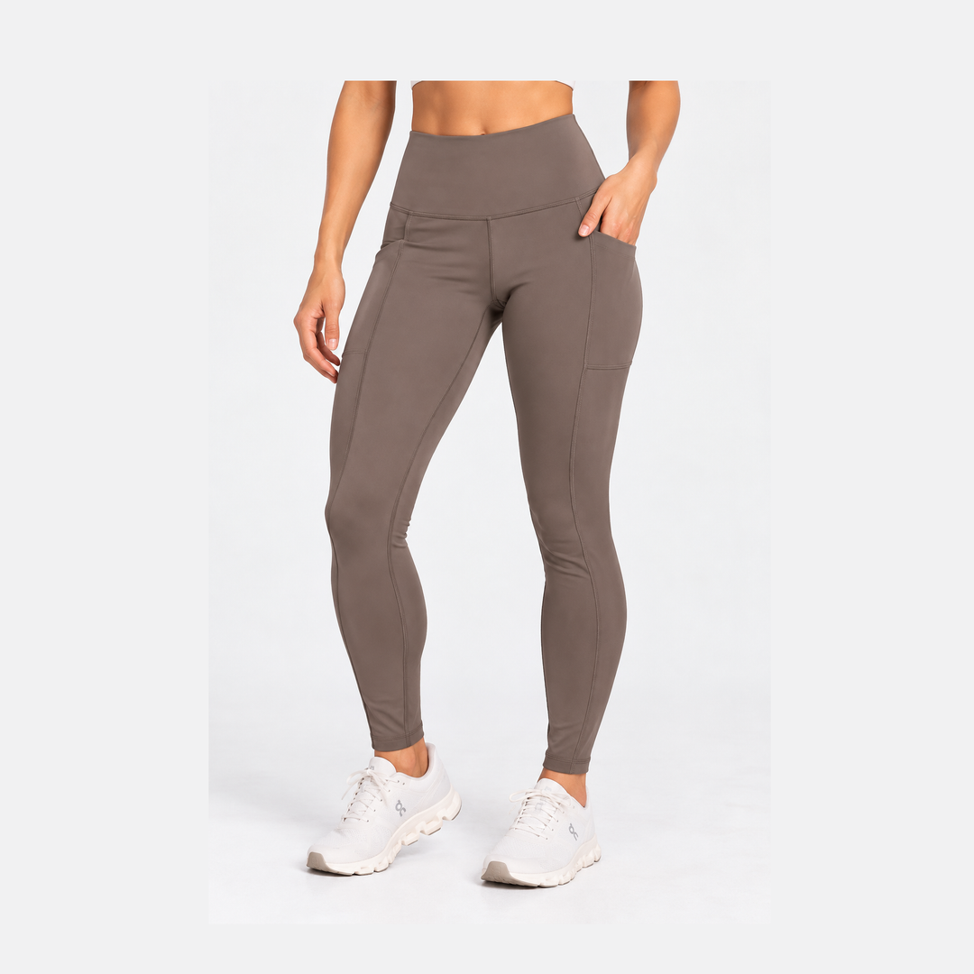 A model wearing high-waisted, form-fitting  Purestretch Legging – Women&