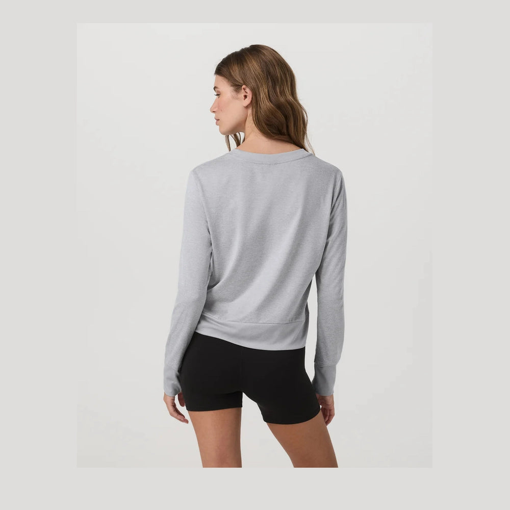 Woman wearing a gray Daydream Crew--Women's top and black shorts on a white background