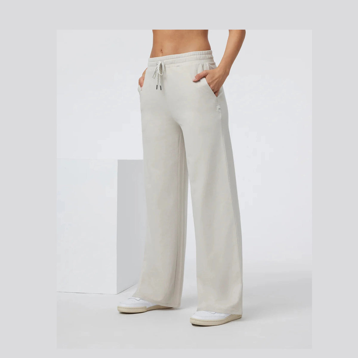 White Vuori Halo Essential Wideleg – Women's wide-leg pants worn by a person on a white background