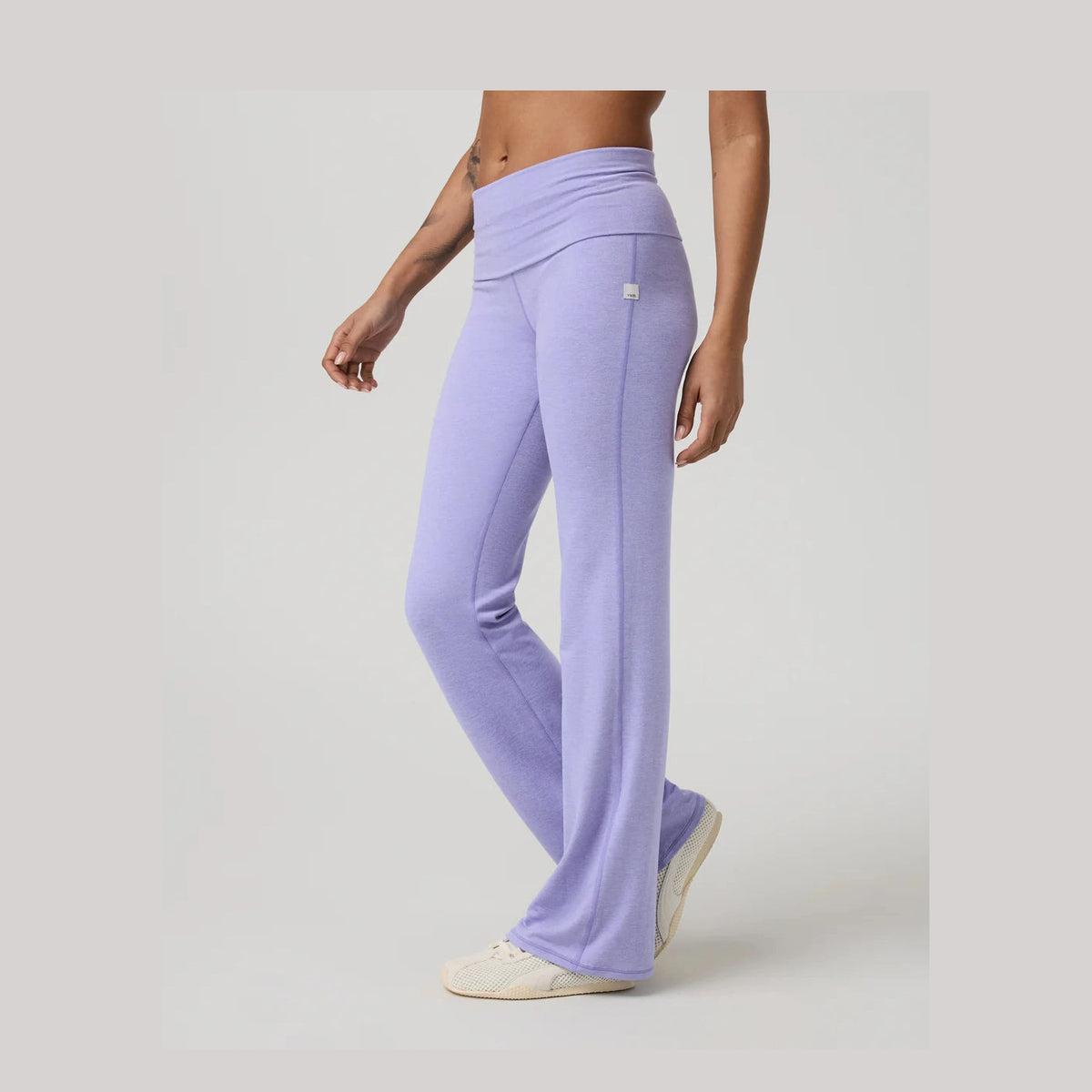 Person wearing lavender Vuori Halo Foldover Pant – Women's yoga pants on a plain background