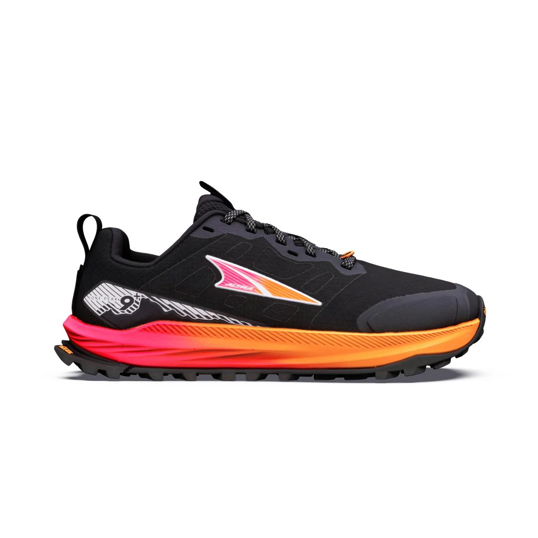 A black Altra Lone Peak 9+ – Women's trail running shoe with a vibrant orange and pink midsole, featuring the Brooks logo on the side, shown against a plain white background.
