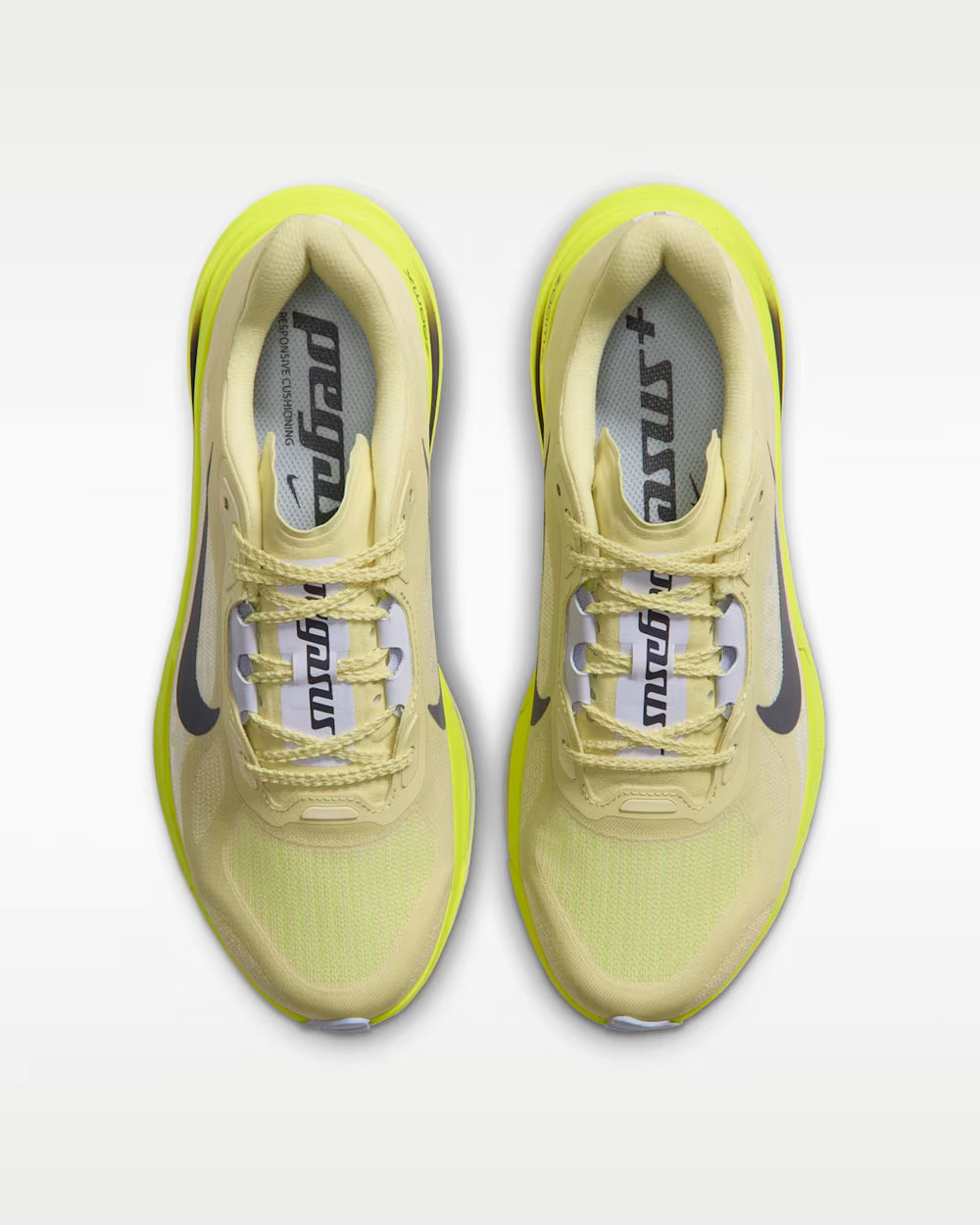 A pair of Nike Pegasus Plus 2 -- Women's running shoes in a pale yellow and neon yellow colorway, shown from a top-down view on a light gray background.