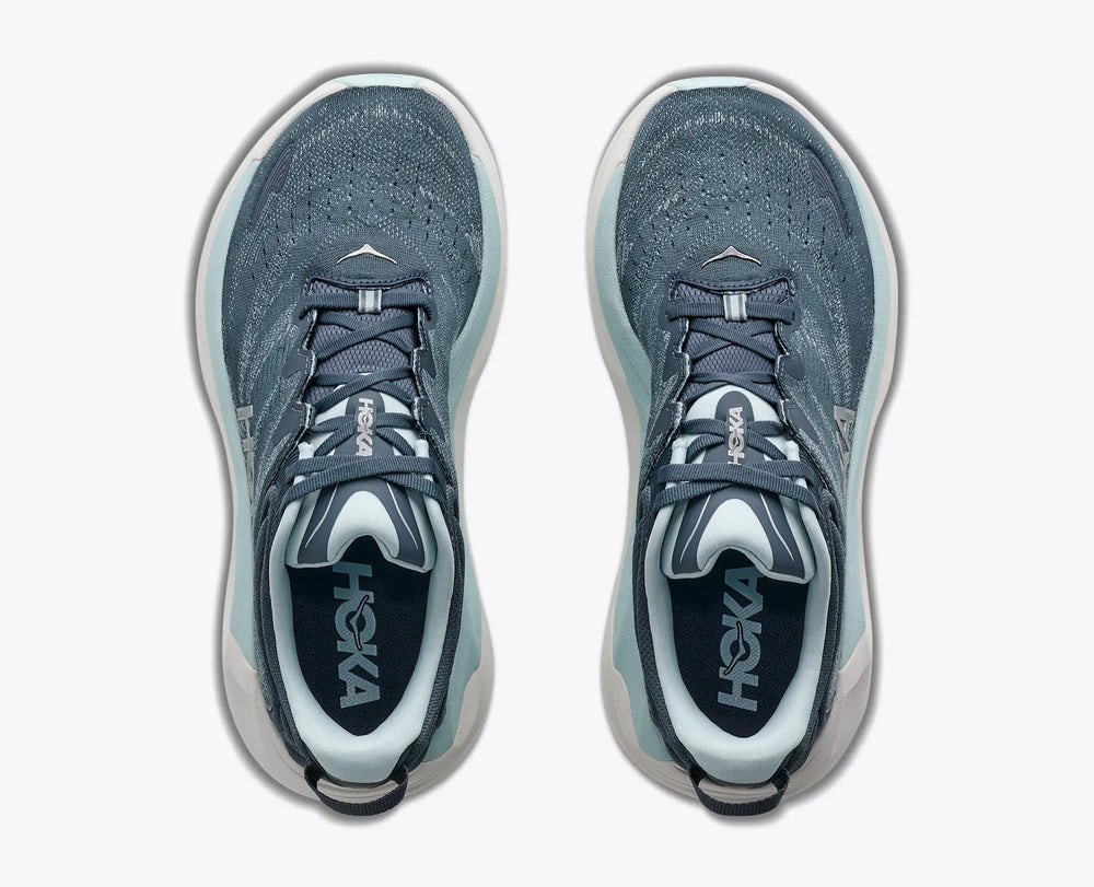 A pair of Hoka Gaviota 6 – Women's running shoes shown from a top-down view, featuring a textured slate blue-gray upper with white and light blue accents on the midsole and collar.