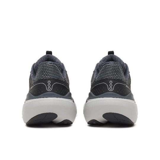 A pair of athletic sneakers shown from the rear, featuring a dark gray and black textured knit upper, a white midsole, and a small white logo on the heel.