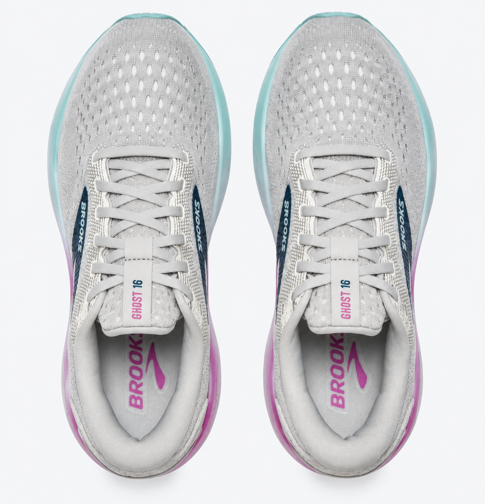 A pair of Brooks Ghost 16 – Women's running shoes shown from a top-down view. The shoes feature a light gray mesh upper, white laces, a light blue translucent midsole, and pink and navy accents on the inner sole and side stripes.