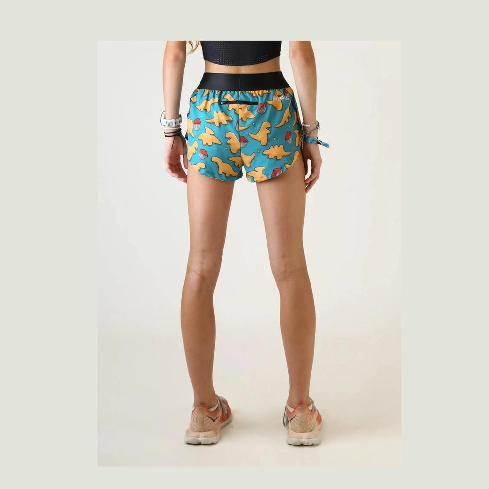 Person wearing Chicknlegs 1.5" Split Shorts – Women's with a pattern on a plain background